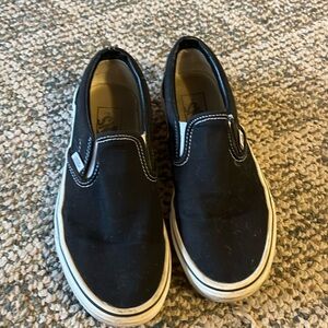 All black slip on Vans